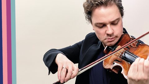 Close up of male violinist, playing instrument