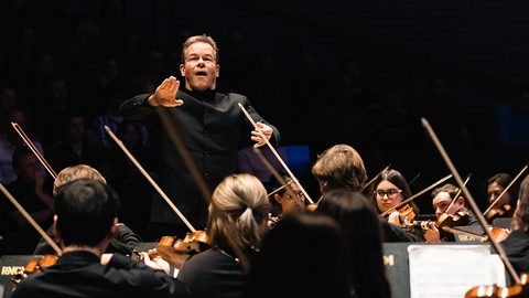 RNCM Symphony Orchestra (conductor with raised hand)
